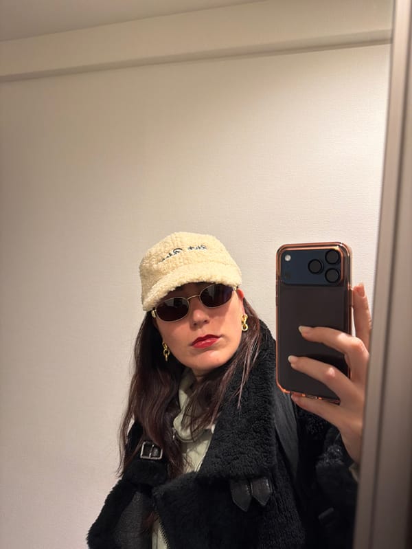 Person takes late-night selfie in fashionable outfit in Shibuya