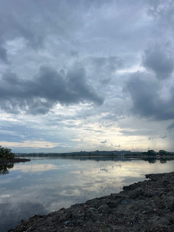 Cloudy skies reflect over waters near Lhokseumawe, Indonesia