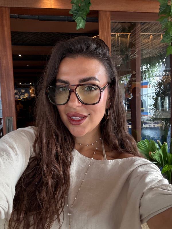 Woman takes selfies indoors in Kuta Selatan, Indonesia