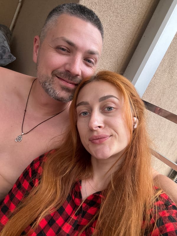 Woman enjoys snacks and selfies on Montenegro balcony