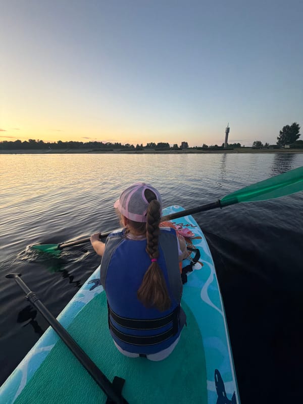 Sunset paddleboarding session on the Daugava River, Latvia