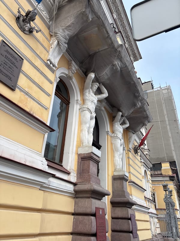 Witness documents classical architecture, parked vehicles in Saint Petersburg