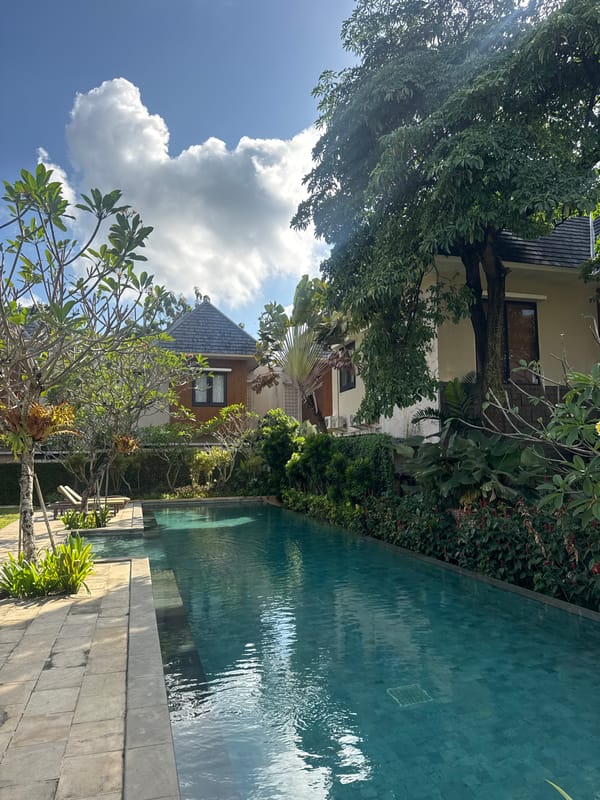 Exploring a lush Bali resort: pools, pathways, and tropical flowers