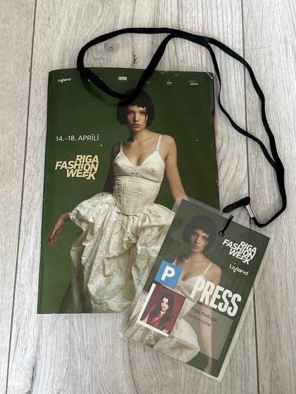 Riga Fashion Week press pass spotted on wooden surface