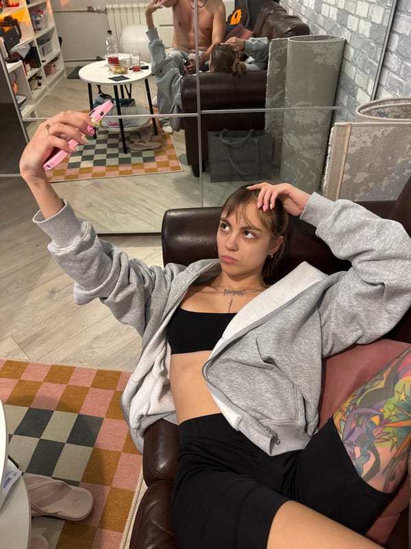 Casual apartment hangout in Moscow, phones out, doing nothing much