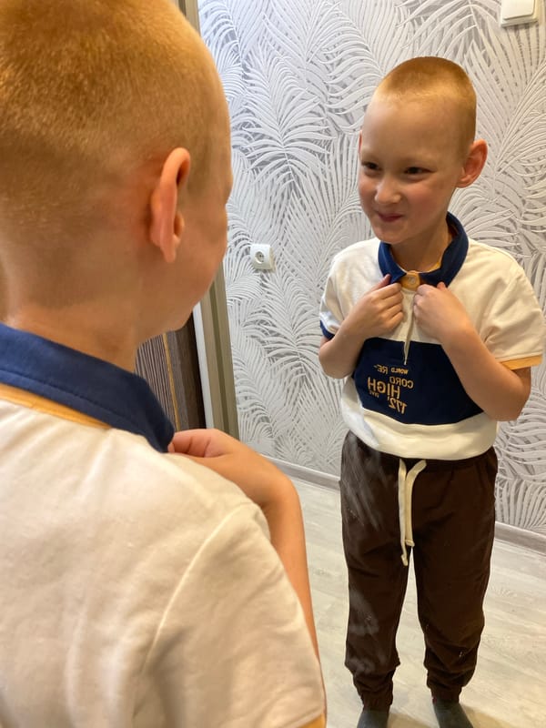 Mother and son share quiet moments in Noviy home