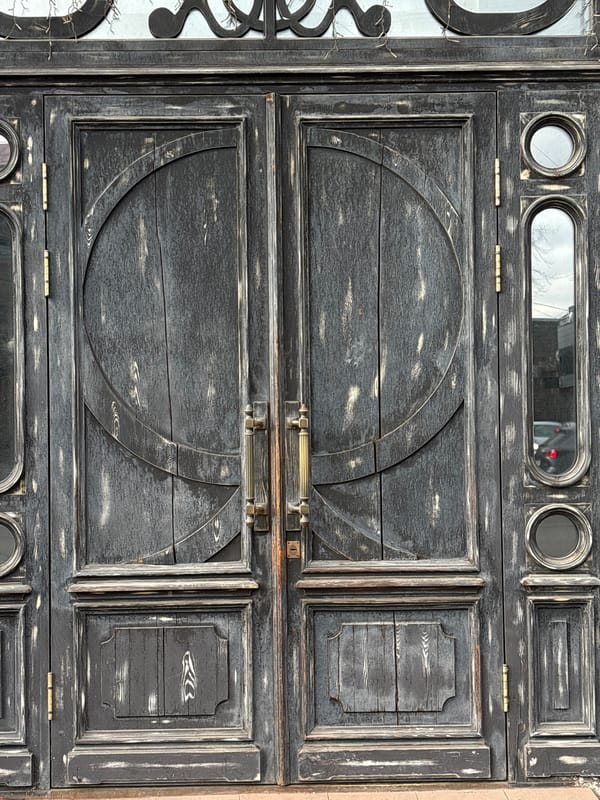 Weathered geometric wooden gate documented in Krasnoyarsk, Russia