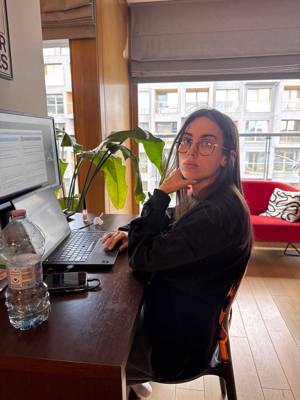 Woman works at home office desk in Warsaw
