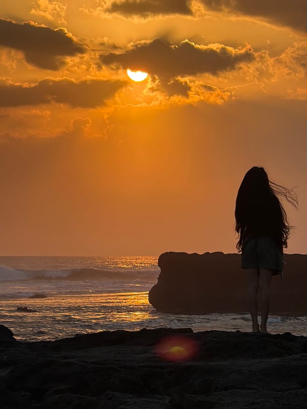Sunset on the rocks at North Kuta's shoreline