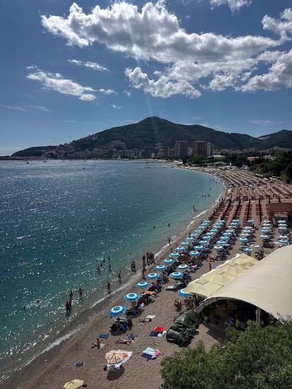 Busy summer afternoon captured along Budva's crowded Adriatic beaches