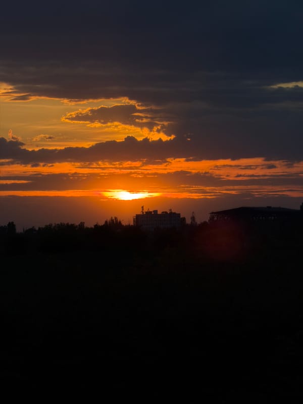 Driver documents sunset through car windows in Yana, Bulgaria