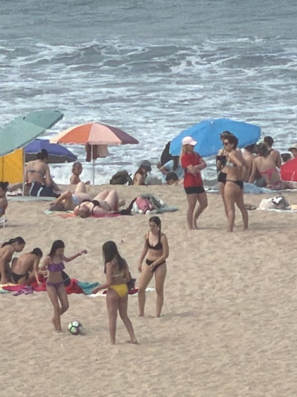 Crowded beach day captured at Espinho, Portugal coastline