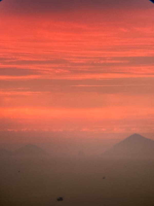 Nha Trang coastline glows under a vivid orange sky