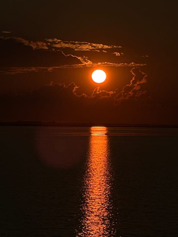 Sailboat on a Kazakh lake at golden hour