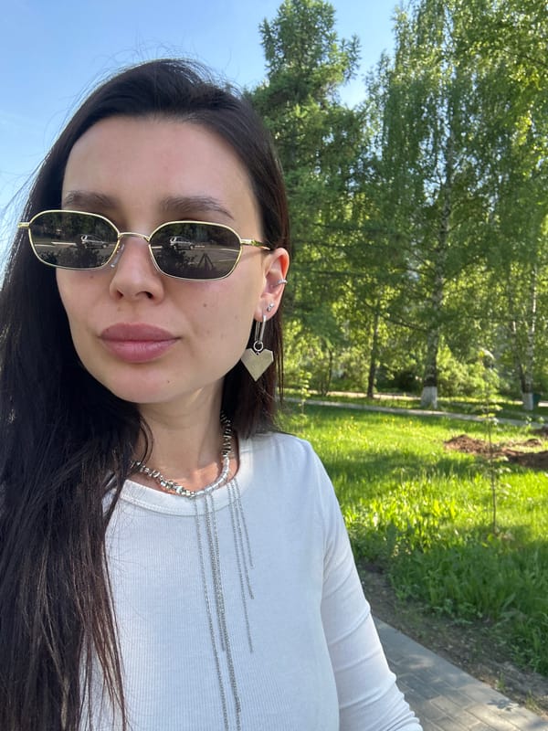 Woman photographed outdoors in Chaikovsky park setting