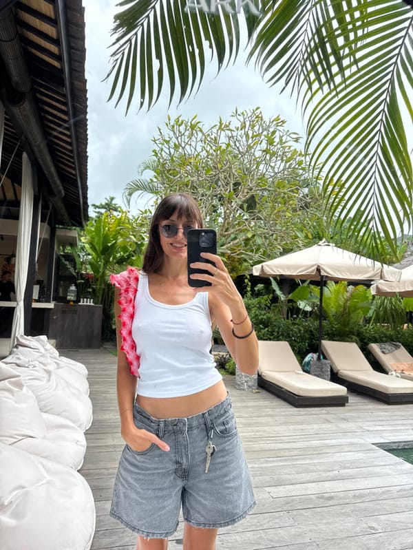 Woman takes mirror selfie at Canggu resort villa