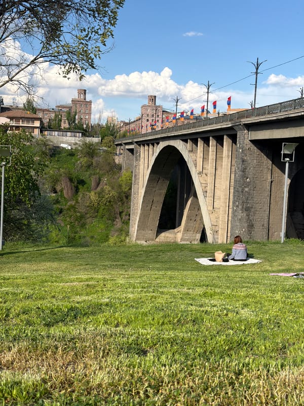 Afternoon moments captured in Yerevan park near bridge