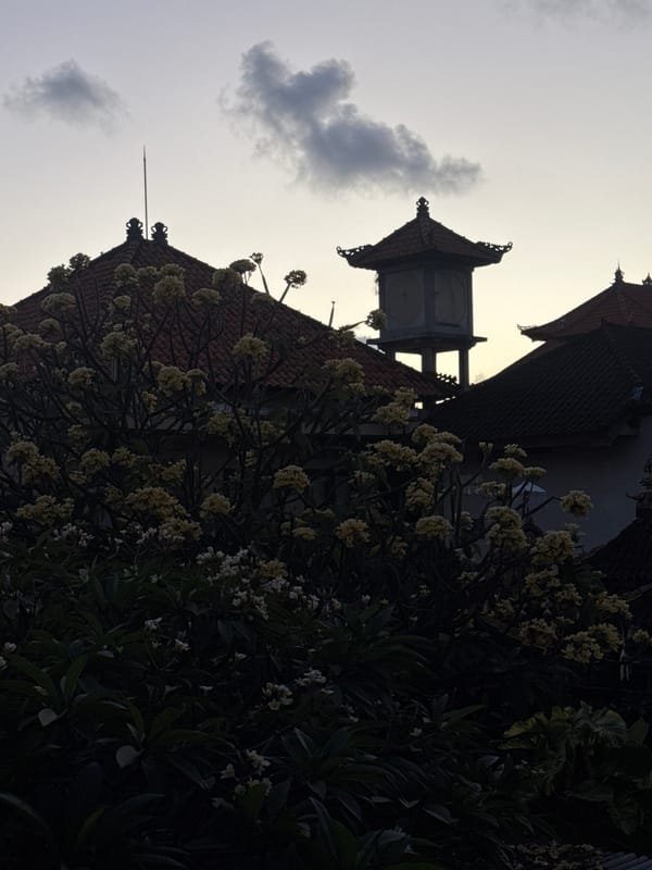 Kuta evening: temple views, a poolside stop, and flower market stalls