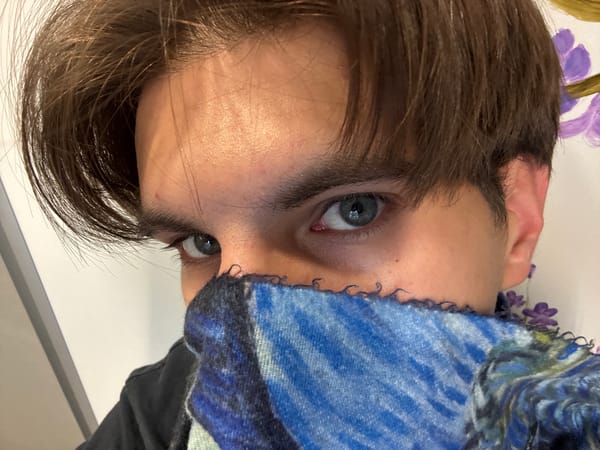 Close-up portrait captured in Sofia showing person with blue scarf