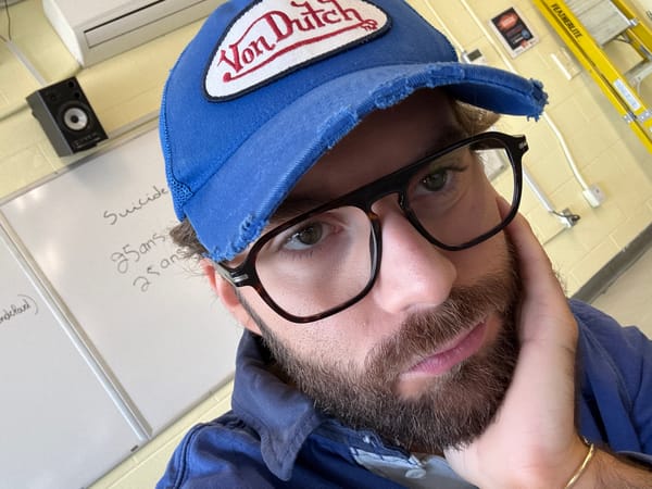 Man in Von Dutch cap photographed taking selfies in Montreal