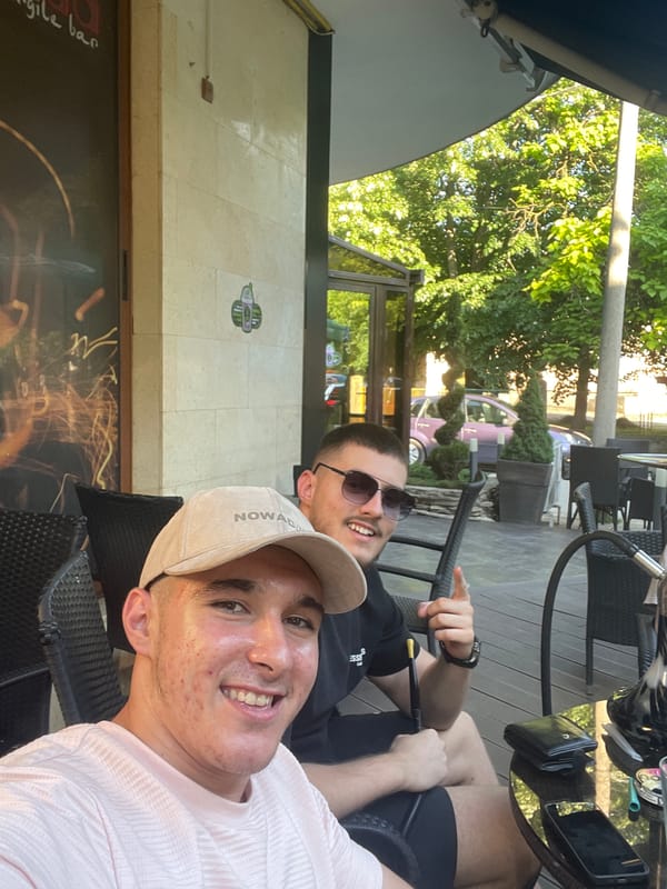 Two men sit at outdoor cafe in Targovishte