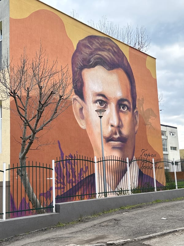 Casual moments captured in Burgas: historic mural, sleeping dogs