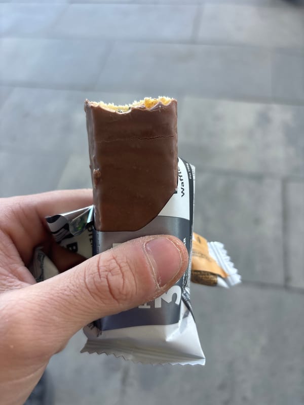 Person enjoys chocolate wafer bar in Plovdiv, Bulgaria