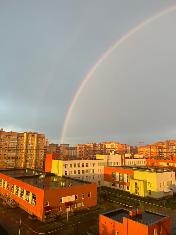 Rainbow appears over Ufa, Russia during golden hour