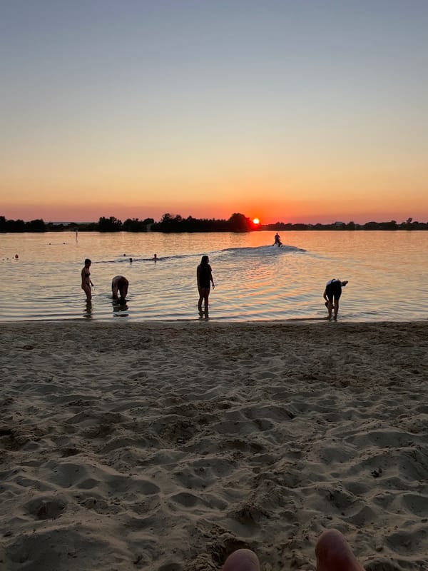 Sunset swim at a sandy Ukrainian lakeshore
