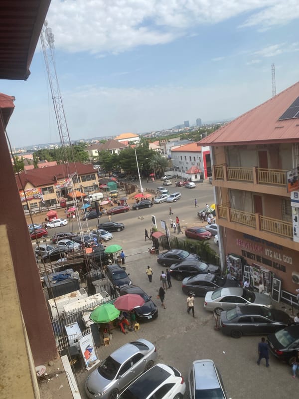 Busy street activity captured in commercial Abuja district