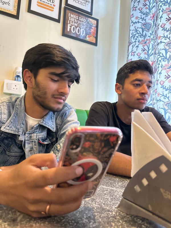 Hanging out at a cafe, phones in hand