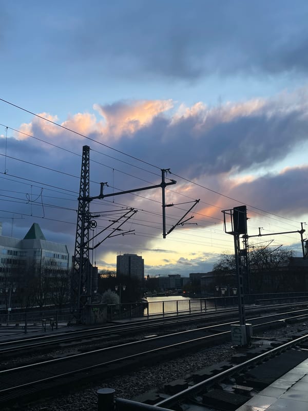 Berlin railway tracks photographed from elevated platform at twilight