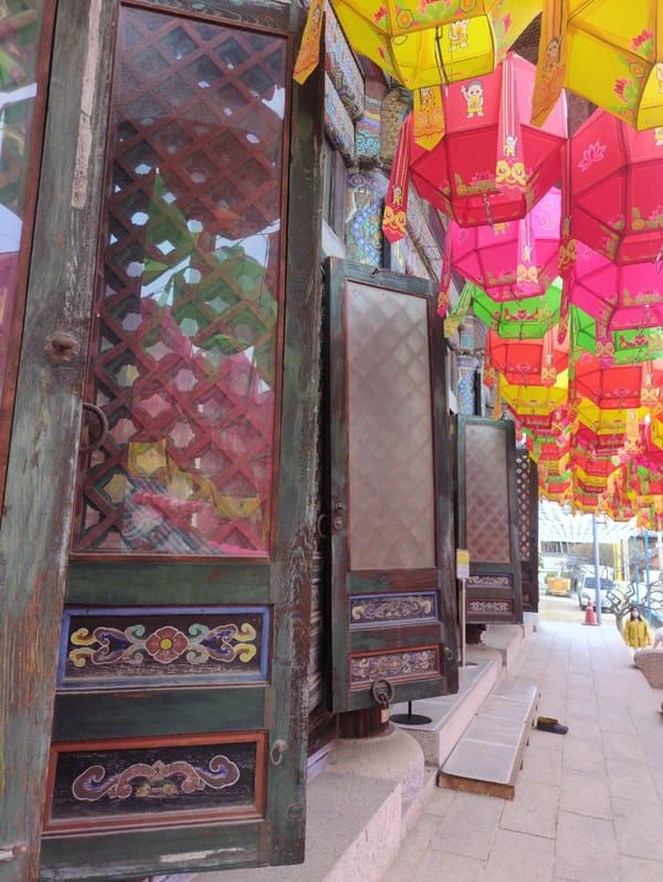 Seoul morning captures: Buddhist temple entrance and charity bazaar