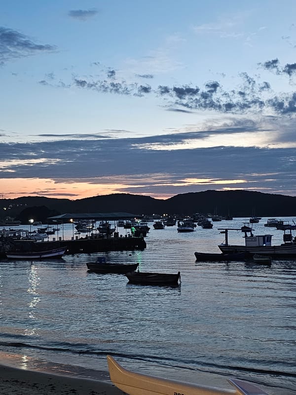 Evening beach gathering during golden sunset in Búzios, Brazil