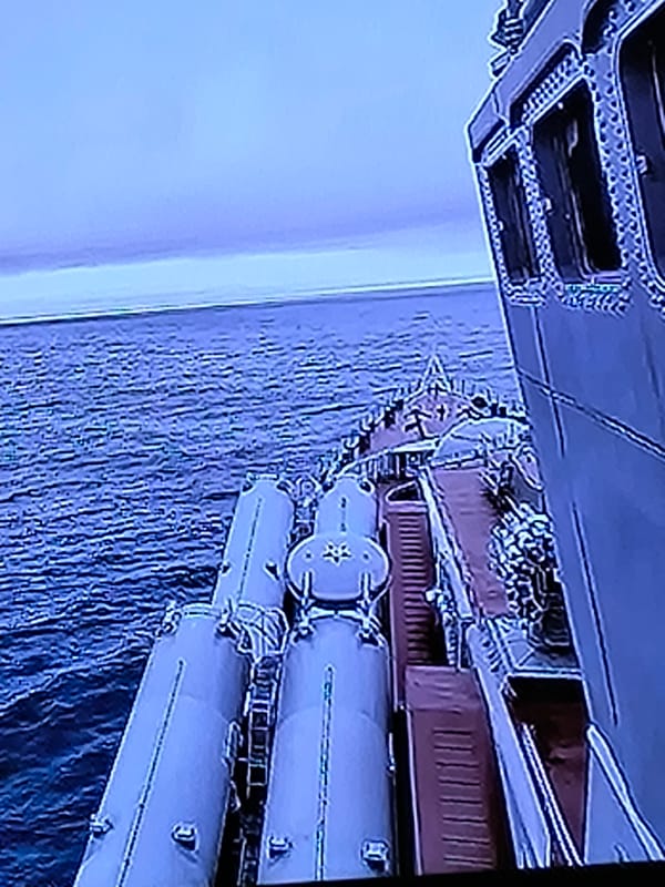 Warship deck and open water activity near Kazan