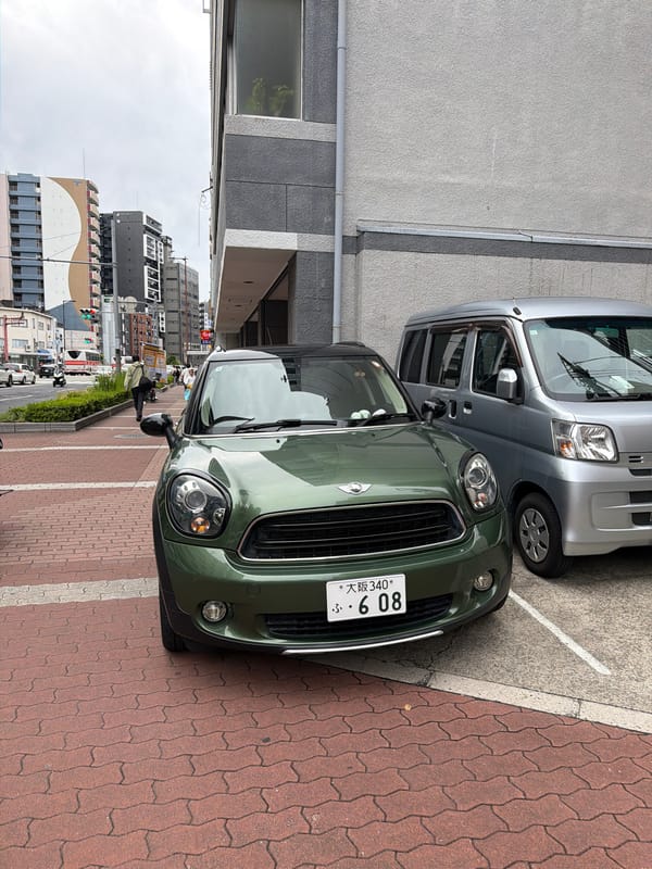Morning street life documented across central Osaka under overcast skies