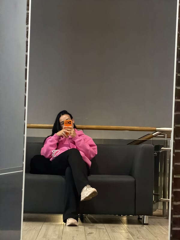 Woman takes selfies on couch in Saint Petersburg apartment