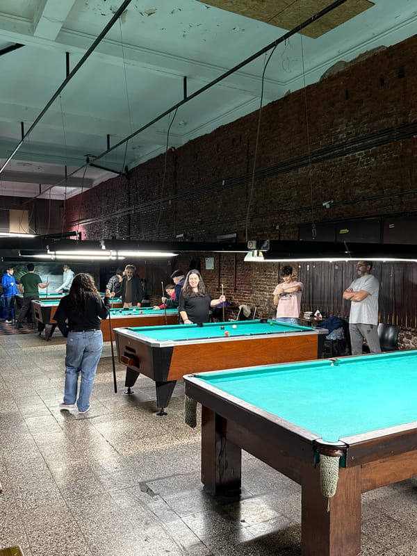 Evening billiards session draws players to Buenos Aires pool hall