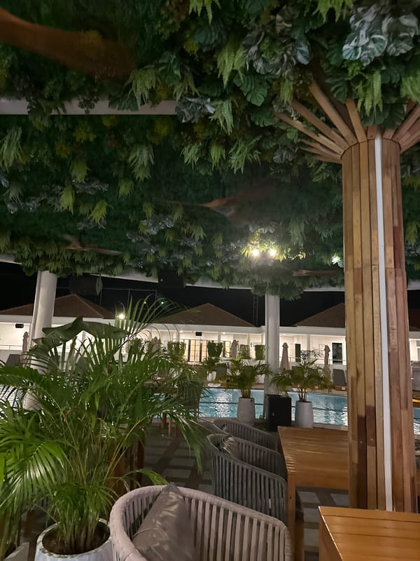 Resort venue documented with pools, dining areas, yellow Mustang