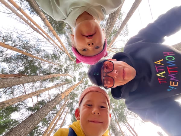Relaxed group moment among pine trees in Chaikovsky