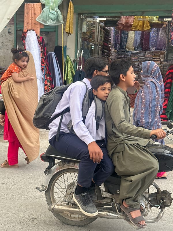Children gather on street near shops in Quetta