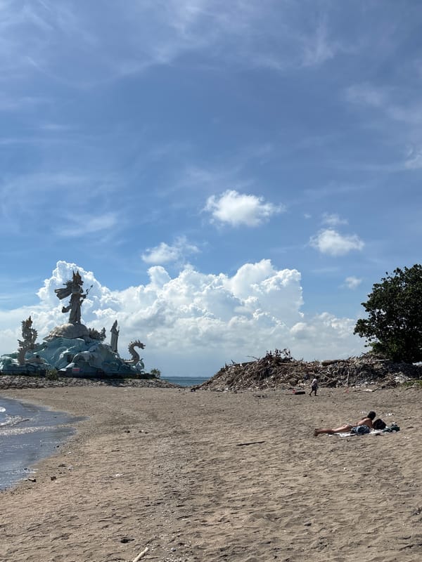 Kite flying observed near Arjuna statue on Kuta beach
