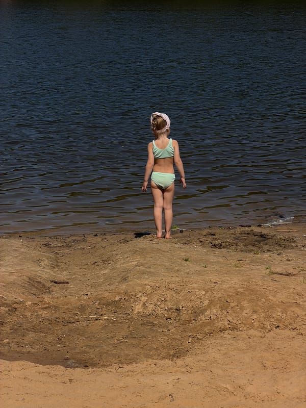 A lazy summer day at a Malakhovka lakeside beach.