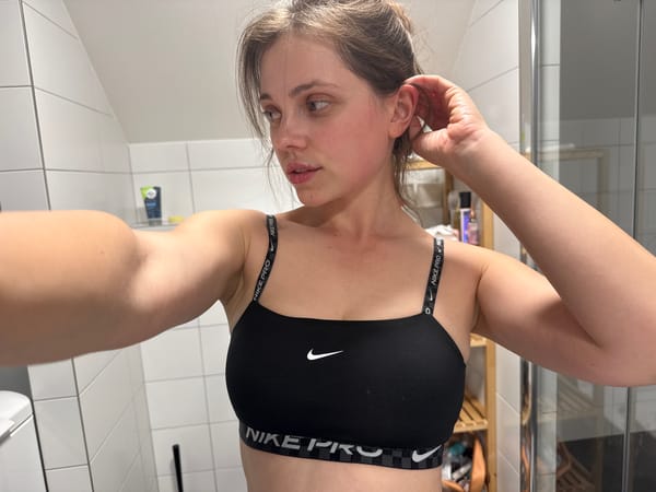 Woman takes bathroom mirror selfies in Vrchlabí