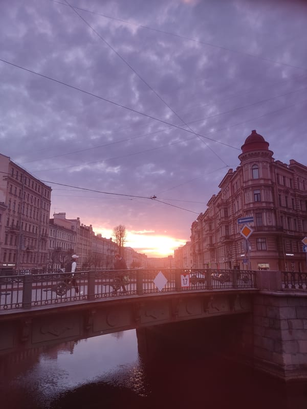 Sunset documented along Saint Petersburg canal with golden reflections