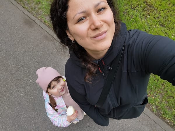 Woman and girl enjoy morning park outing in Perm