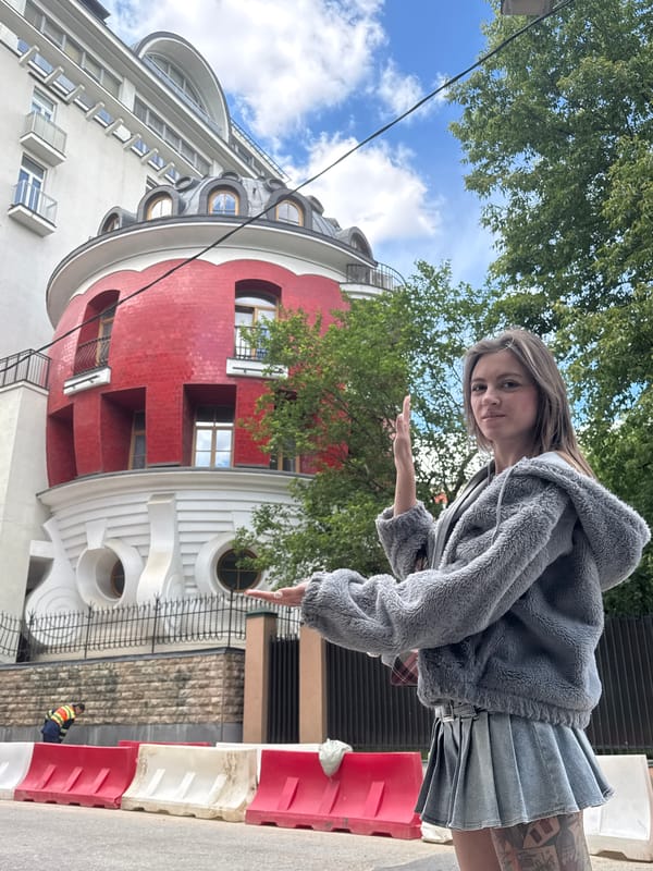 Street-level shots near a striking red-and-white Moscow building