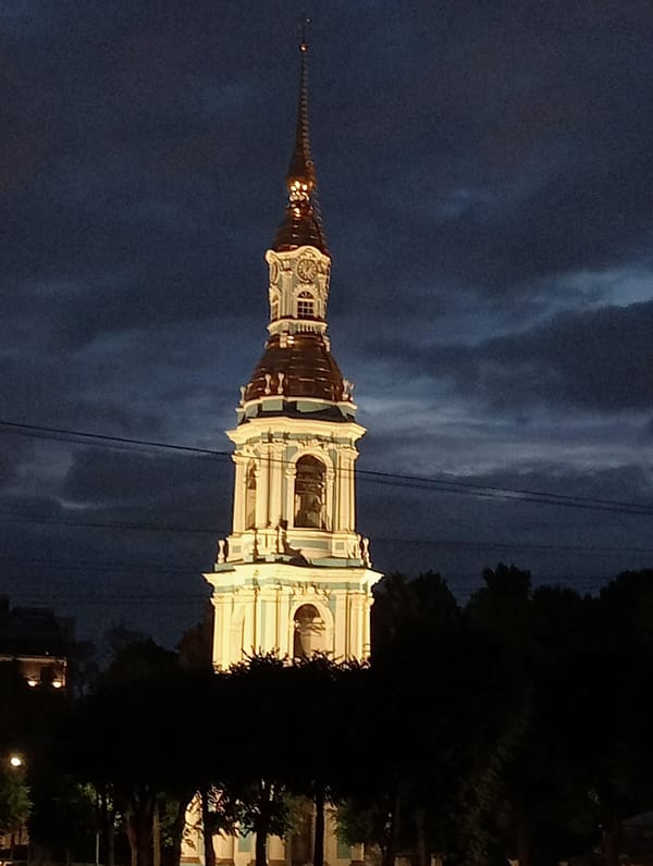 Peter and Paul Cathedral spire glows over St. Petersburg at night