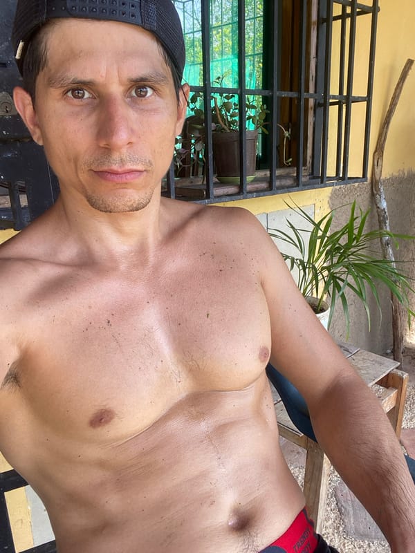Man poses for photo in Venezuelan town, coffee request noted