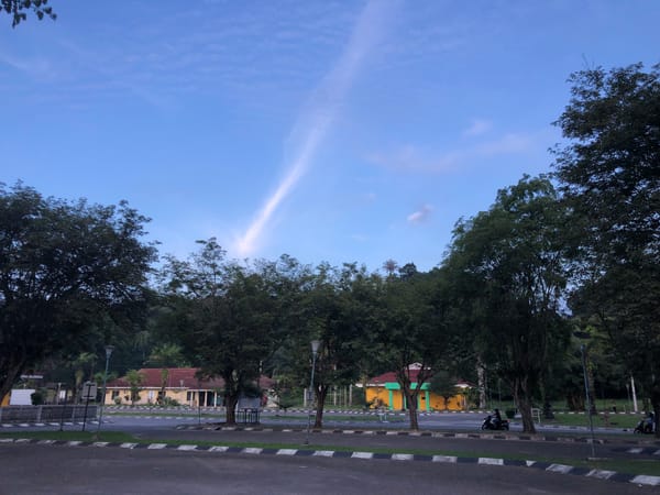 Around a civic sports facility in Lhokseumawe, midday.